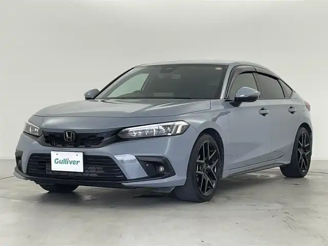 ホンダ シビック EX 群馬県 2022(令4)年 3.6万km ソニックグレーパール 純正9型ディスプレイオーディオ/(AM/FM/Bluetooth/フルセグTV//USB/AppleCarPlay/AndroidAuto)/バックモニター/BOSEサウンドシステム/ワイヤレス充電器/10.2インチデジタルグラフィックメーター/LEDアクティブコーナリングライト/LEDフォグライト/Honda SENSING/ ・衝突軽減ブレーキ/近距離衝突軽減ブレーキ/ ・歩行者事故低減ステアリング/ ・路外逸脱抑制機能/ ・渋滞追従機能付アダプティブクルーズコントロール/ ・車線維持支援システム/ ・先行車発進お知らせ機能/ ・標識認識機能/ ・オートハイビーム/ ・アダプティブドライビングビーム/ ・ブラインドスポットインフォメーション/ ・パーキングセンサーシステム/ ・後退出庫サポート/ ・誤発進抑制機能/後方誤発進抑制機能/ ・トラフィックジャムアシスト/前席パワーシート/前席シートヒーター/ビルトインETC2.0/電動パーキングブレーキ/オートブレーキホールド/プッシュスタート/スマートキー/スペアキー有