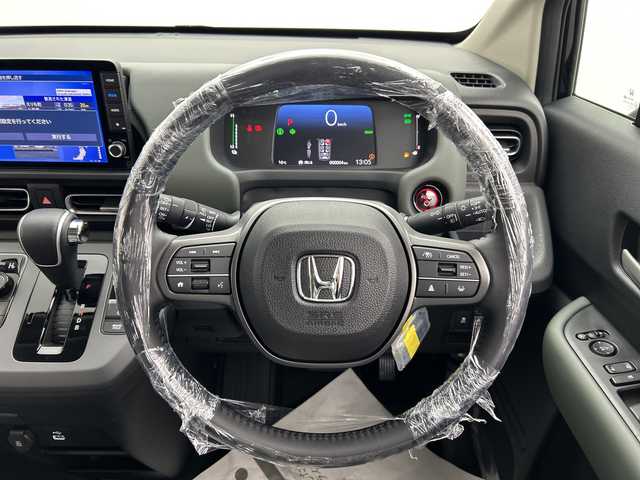 ホンダ フリード ハイブリット e:HEV クロスター 三重県 2025(令7)年 0.1千km クリスタルブラックパール /登録済未使用車//登録時走行距離4km//純正9インチメモリーナビ　LXM-242ZFNI(207/680円)//バックカメラ//オートAC//DN席シートヒーター//電子サイドブレーキ//ブレーキオートホールド//革巻きステアリング//ステアリングスイッチ//ホンダセンシング//衝突軽減ブレーキ//レーンキープアシスト//レーダークルーズコントロール//ブラインドスポットモニター//前後コーナーセンサー//ハーフレザーシート//ルーフレール//サイドカーテンエアバッグ
