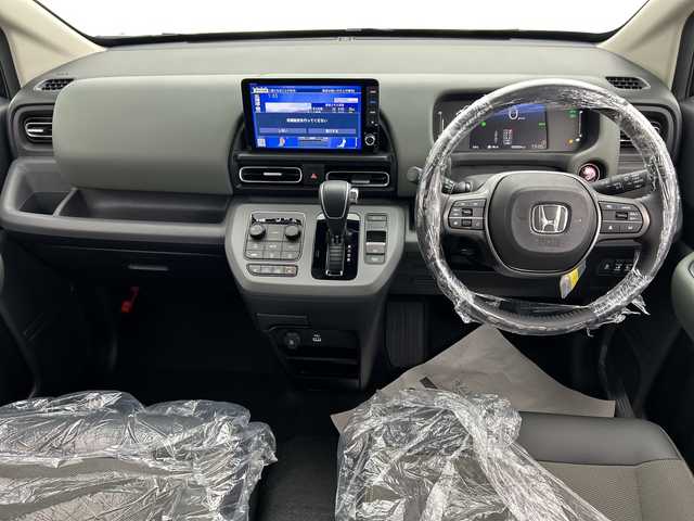 ホンダ フリード ハイブリット e:HEV クロスター 三重県 2025(令7)年 0.1千km クリスタルブラックパール /登録済未使用車//登録時走行距離4km//純正9インチメモリーナビ　LXM-242ZFNI(207/680円)//バックカメラ//オートAC//DN席シートヒーター//電子サイドブレーキ//ブレーキオートホールド//革巻きステアリング//ステアリングスイッチ//ホンダセンシング//衝突軽減ブレーキ//レーンキープアシスト//レーダークルーズコントロール//ブラインドスポットモニター//前後コーナーセンサー//ハーフレザーシート//ルーフレール//サイドカーテンエアバッグ