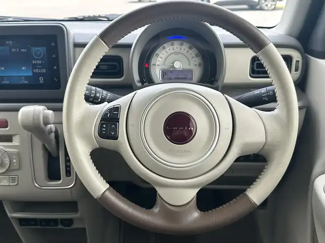 スズキ ラパン ＬＣ L 千葉県 2023(令5)年 0.6万km フォーンベージュM 純正ディスプレイオーディオ/(BT/FM/AM)/バックカメラ/衝突被害軽減システム/車線逸脱警報/横滑り防止装置/アイドリングストップ/LEDヘッドライト/オートライト/ウィンカーミラー/電動格納ミラー/社外14インチAW/シートヒーター/シートリフター/プッシュスタート/スマートキー/フロアマット/スペアキー/取扱説明書/保証書