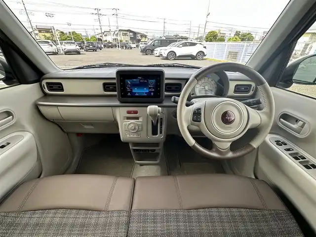 スズキ ラパン ＬＣ L 千葉県 2023(令5)年 0.6万km フォーンベージュM 純正ディスプレイオーディオ/(BT/FM/AM)/バックカメラ/衝突被害軽減システム/車線逸脱警報/横滑り防止装置/アイドリングストップ/LEDヘッドライト/オートライト/ウィンカーミラー/電動格納ミラー/社外14インチAW/シートヒーター/シートリフター/プッシュスタート/スマートキー/フロアマット/スペアキー/取扱説明書/保証書