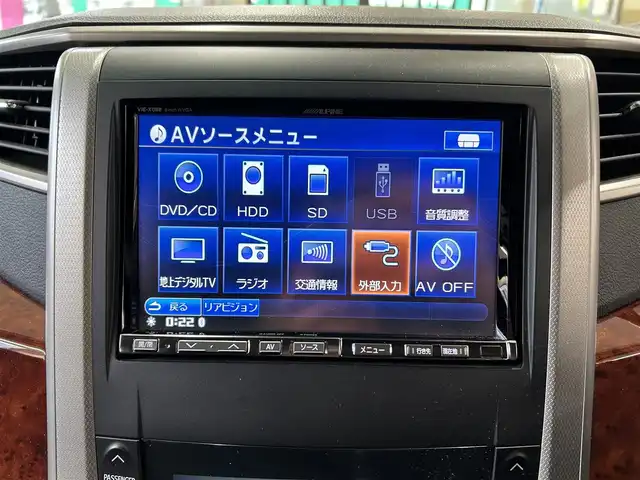 トヨタ ヴェルファイア 2．4Z プラチナセレクションⅡ 東京都 2011(平23)年 4.9万km ブラック ワンオーナー/社外ナビ（AM/FM/CD/DVD/ワンセグTV）/F/Rコーナーセンサー/クリアランスソナー/両側パワースライドドア/スペアタイヤ有/電動リアゲート/クルーズコントロール/前側ドラレコ/スマートキー/プッシュスタート/ETC/LEDライト/オートライト/ステアリングスイッチ/ウッドコンビステアリング/木目調パネル/純正フロアマット/2列目オットマン/ドアバイザー/電格ウィンカーミラー/ISOFIX/横滑り防止機能/保証書/取扱説明書/記録簿