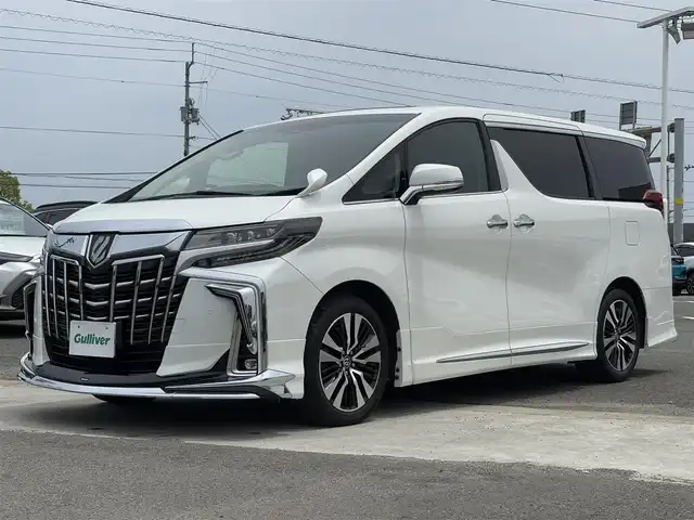 トヨタ アルファード S Cパッケージ 徳島県 2021(令3)年 2.5万km ホワイトパールクリスタルシャイン トヨタセーフティセンス　/モデリスタフルエアロ　/サンルーフ　/三眼LEDヘッドライト/LEDフォグランプ/バックモニター　/レザーシート/クール＆シートヒーター/クリアランスソナー/シーケンシャルウィンカーミラー/モデリスタＦグリルカバー　/モデリスタシグネーチャーイルミネーション　/ウッドコンビハンドル/プッシュスタート/スマートキー/電気式パーキングブレーキ/オートホールド/デジタルインナーミラー　/ブラインドスポットモニター/ビルトインＥＴＣ　/社外フロアマット/AC100V100Wコンセント
