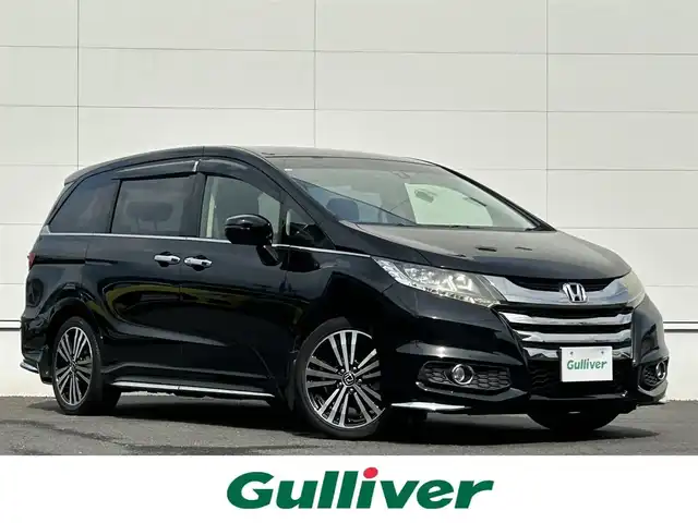 ホンダ オデッセイ アブソルート EX 佐賀県 2014(平26)年 2.6万km クリスタルブラックパール CTBA/ブラインドスポットインフォメーション/クルーズコントロール/純正ナビ/・バックカメラ/・フルセグTV/BT/CD/DVD/ALPINEフリップダウンモニター/純正18インチAW/両側パワースライドドア/ハーフレザーシート/パワーシート/オットマン/LEDヘッドライト/オートライト/フォグランプ/本革巻きステアリング/パドルシフト/ETC/プッシュスタート/スペアキー×１/保証書/取扱説明書
