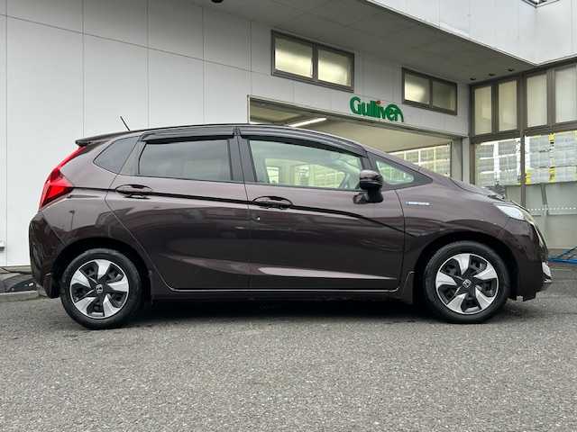 ホンダ フィット ハイブリット Fパッケージ コンフォートED 宮城県 2016(平28)年 12.1万km プレミアムディープモカパール 特別仕様車/ワンオーナー/ハイブリッド/純正メモリナビ/・CD/SD/BT/ワンセグTV/バックカメラ/ステアリングスイッチ/運転席/助手席シートヒーター/プラズマクラスター/アームレスト付センターコンソールボックス/純正キャップ付きスチール＆ノーマルタイヤ/社外アルミ＆スタッドレス積込/アイドリングストップ/プッシュスタート/スマートキー/スペアキー/保証書/取扱説明書