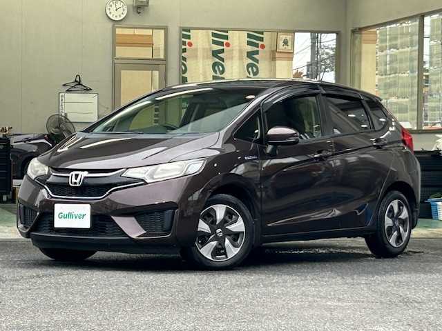 ホンダ フィット ハイブリット Fパッケージ コンフォートED 宮城県 2016(平28)年 12.1万km プレミアムディープモカパール 特別仕様車/ワンオーナー/ハイブリッド/純正メモリナビ/・CD/SD/BT/ワンセグTV/バックカメラ/ステアリングスイッチ/運転席/助手席シートヒーター/プラズマクラスター/アームレスト付センターコンソールボックス/純正キャップ付きスチール＆ノーマルタイヤ/社外アルミ＆スタッドレス積込/アイドリングストップ/プッシュスタート/スマートキー/スペアキー/保証書/取扱説明書