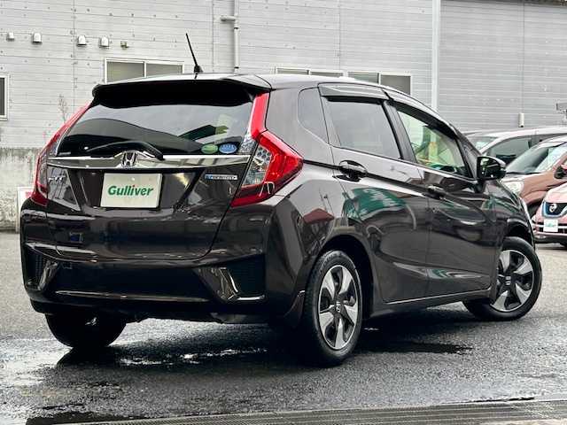 ホンダ フィット ハイブリット Fパッケージ コンフォートED 宮城県 2016(平28)年 12.1万km プレミアムディープモカパール 特別仕様車/ワンオーナー/ハイブリッド/純正メモリナビ/・CD/SD/BT/ワンセグTV/バックカメラ/ステアリングスイッチ/運転席/助手席シートヒーター/プラズマクラスター/アームレスト付センターコンソールボックス/純正キャップ付きスチール＆ノーマルタイヤ/社外アルミ＆スタッドレス積込/アイドリングストップ/プッシュスタート/スマートキー/スペアキー/保証書/取扱説明書