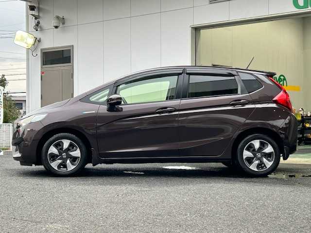 ホンダ フィット ハイブリット Fパッケージ コンフォートED 宮城県 2016(平28)年 12.1万km プレミアムディープモカパール 特別仕様車/ワンオーナー/ハイブリッド/純正メモリナビ/・CD/SD/BT/ワンセグTV/バックカメラ/ステアリングスイッチ/運転席/助手席シートヒーター/プラズマクラスター/アームレスト付センターコンソールボックス/純正キャップ付きスチール＆ノーマルタイヤ/社外アルミ＆スタッドレス積込/アイドリングストップ/プッシュスタート/スマートキー/スペアキー/保証書/取扱説明書