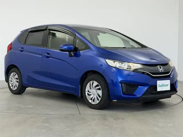 ホンダ フィット 13G Lパッケージ 愛知県 2015(平27)年 6万km ブリリアントスポーティブルーメタリック2トーン ・シティーブレーキアクティブ【CTBA】/・横滑り防止装置/・純正ナビ/（Bluetooth/ワンセグ/AM/FM)/・純正ドライブレコーダ/・アイドリングストップ/・革巻きステア/・オートLEDヘッドライト/・シートリフター/・電動格納ミラー/・ウィンカーミラー/・ステアスイッチ/・ドアバイザー/・スペアキー