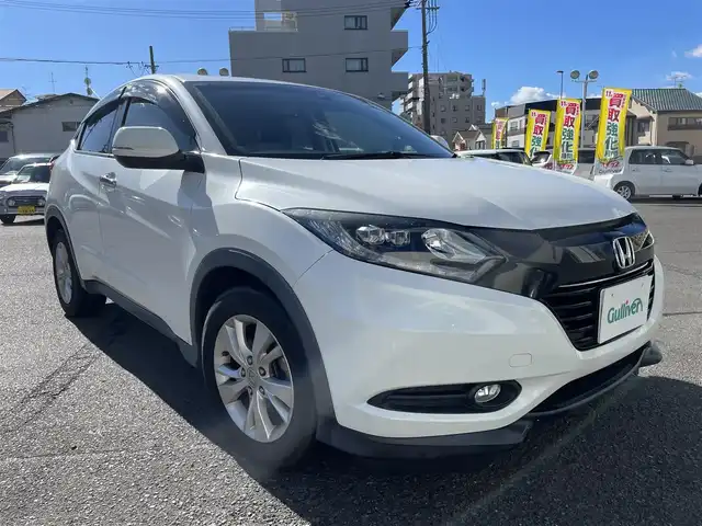 ホンダ ヴェゼル X ホンダセンシング 静岡県 2016(平28)年 14.5万km ホワイトオーキッドパール ワンオーナー/純正メモリナビ・フルセグTV/DVD/CD/USB/SD/Bluetooth/バックカメラ/HONDA SENSING/・アダプティブクルーズコントロール（ACC）/・衝突軽減ブレーキ（CMBS）/・車線維持支援システム（LKAS）/・誤発進抑制機能/・先行車発進お知らせ機能/・オートハイビーム/・標識認識機能/純正16インチアルミホイール/LEDヘッドライト/ビルトインETC/スマートキー/プッシュスタート/新車時保証書/取扱説明書