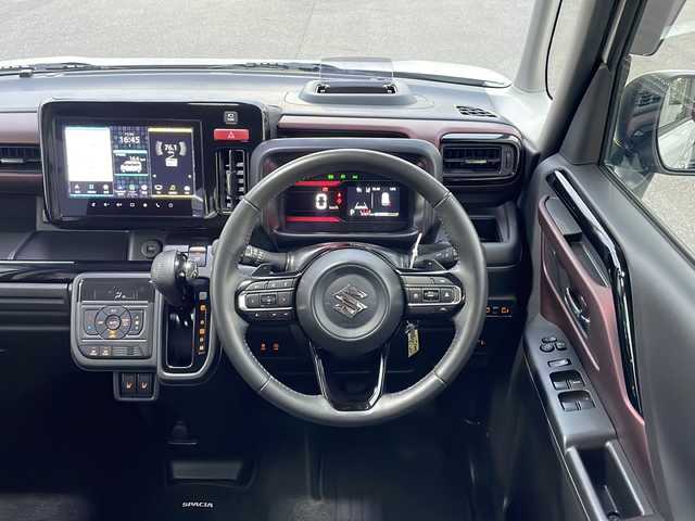 スズキ スペーシア カスタム HYBRID XS ターボ 山口県 2024(令6)年 3.2万km ピュアホワイトP メーカーオプションナビ/　・9インチモニター/　・AM/FMラジオ/　・フルセグTV/　・Bluetoothオーディオ/　・ハンズフリー通話/　・USBデータ通信/　・iPod接続/　・HDMI映像入力/　・SmartphoneLink/スズキセーフティサポート/　・衝突軽減ブレーキ/　・前後コーナーセンサー/　・先行車発進通知/　・標識認識/　・リアトラフィックアラート/　・誤発進抑制機能/　・車線維持逸脱通知/　・車線維持操舵支援/　・アダプティブクルーズコントロール/　・トラクションコントロール/LEDオートライト/LEDフォグランプ/LEDミラーウィンカー/フルオートAC/ルーフサーキュレーター/ヘッドアップディスプレイ/両側電動スライドドア/ステアリングヒーター/D席/N席シートヒーター/両席シートバックテーブル/パドルシフト/本革巻チルトステアリング/ステアリングリモコン/電子パーキングブレーキ/ALPINEミラー一体型ドライブレコーダー(前後録画)/後席ロールサンシェード/後席オットマン/後席ISOFIXシート/スマートキー/イモビライザー/プッシュスタート/USBソケット/メンテナンスノート