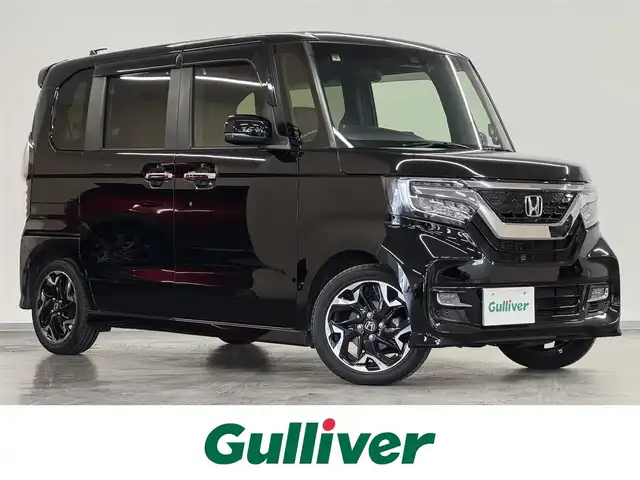 ホンダ Ｎ ＢＯＸ カスタム G L ターボ ホンダセンシング 三重県 2020(令2)年 5.2万km クリスタルブラックパール ガソリンターボ/FF/MTモード付インパネCVT/純正 8型ナビ VXU-207NBi/（CD/DVD/RADIO/TV/SD/MUSIC RACK/USB/iPod/Bluetooth/CarPlay）/バックカメラ/両側パワースライドドア/ドライブレコーダー 前後/ビルトイン ETC/Honda SENSING/・衝突軽減ブレーキ［CMBS］/・車線維持支援システム［LKAS］/・路外逸脱抑制機能/・アダプティブクルーズコントロール［ACC］/・先行車発進お知らせ機能/・標識認識機能/装備/・ハーフレザーシート/・シートヒーター（D/N）/・オートライトシステム/・LEDヘッドライト/・オートハイビーム機能/・LEDフロントフォグライト/・オートエアコン/・USB充電ジャック 2.1A x2/・プッシュスタート/・パドルシフト/・後席チップアップ&ダイブダウン機能/・ステアリングリモコン/・純正15inAW