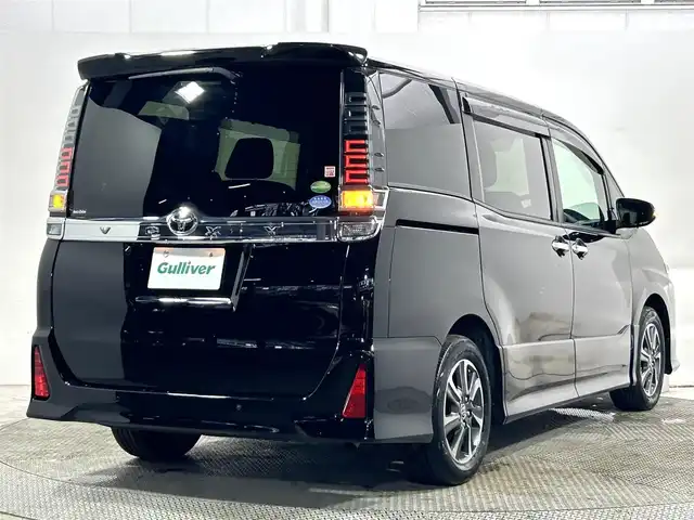 トヨタ ヴォクシー ZS 煌Ⅱ 大阪府 2019(令1)年 2.4万km ブラック 純正9incナビ(フルセグ/DVD再生/Bluetooth) バックカメラ 後席モニター ETC 両側パワースライドドア 衝突軽減 クルコン クリアランスソナー トヨタセーフティセンス ドラレコ