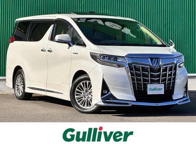 トヨタ アルファードハイブリット G Fパッケージ 宮城県 2018(平30)年 7.2万km ホワイトパールクリスタルシャイン ～メーカーOP～/ツインムーンルーフ/デジタルインナーミラー/インテリジェントクリアランスソナー/3眼LEDヘッドランプセット/・LEDイルミネーション機能付3眼LEDヘッドランプ/・シーケンシャルターンランプ/・アダプティブハイビームシステム/＝＝＝＝＝＝＝＝＝＝＝＝＝＝＝＝＝＝＝＝＝＝＝＝＝/～ディーラーOP～/純正10インチSDナビ/・フルセグ・CD・DVD・SD【録画機能付】・Bluetooth/モデリスタフルエアロ/バックカメラ/ビルドインETC/純正ドアバイザー/純正フロアマット/＝＝＝＝＝＝＝＝＝＝＝＝＝＝＝＝＝＝＝＝＝＝＝＝＝/ワンオーナー/セーフティセンス【予防安全パッケージ】/・プリクラッシュセーフティ/・レーダークルーズコントロール【全車追従機能付】/・オートマチックハイビーム/・レーントレーシングアシスト/・ロードサインアシスト/ベージュ革シート/・エアシート/・パワーシート/・シートヒーター/パワーバックドア/両側電動スライドドア/純正17インチアルミホイール/保証書/取扱説明書/スペアキー/記録簿