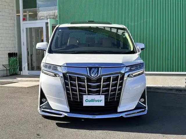 トヨタ アルファードハイブリット G Fパッケージ 宮城県 2018(平30)年 7.2万km ホワイトパールクリスタルシャイン ～メーカーOP～/ツインムーンルーフ/デジタルインナーミラー/インテリジェントクリアランスソナー/3眼LEDヘッドランプセット/・LEDイルミネーション機能付3眼LEDヘッドランプ/・シーケンシャルターンランプ/・アダプティブハイビームシステム/＝＝＝＝＝＝＝＝＝＝＝＝＝＝＝＝＝＝＝＝＝＝＝＝＝/～ディーラーOP～/純正10インチSDナビ/・フルセグ・CD・DVD・SD【録画機能付】・Bluetooth/モデリスタフルエアロ/バックカメラ/ビルドインETC/純正ドアバイザー/純正フロアマット/＝＝＝＝＝＝＝＝＝＝＝＝＝＝＝＝＝＝＝＝＝＝＝＝＝/ワンオーナー/セーフティセンス【予防安全パッケージ】/・プリクラッシュセーフティ/・レーダークルーズコントロール【全車追従機能付】/・オートマチックハイビーム/・レーントレーシングアシスト/・ロードサインアシスト/ベージュ革シート/・エアシート/・パワーシート/・シートヒーター/パワーバックドア/両側電動スライドドア/純正17インチアルミホイール/保証書/取扱説明書/スペアキー/記録簿