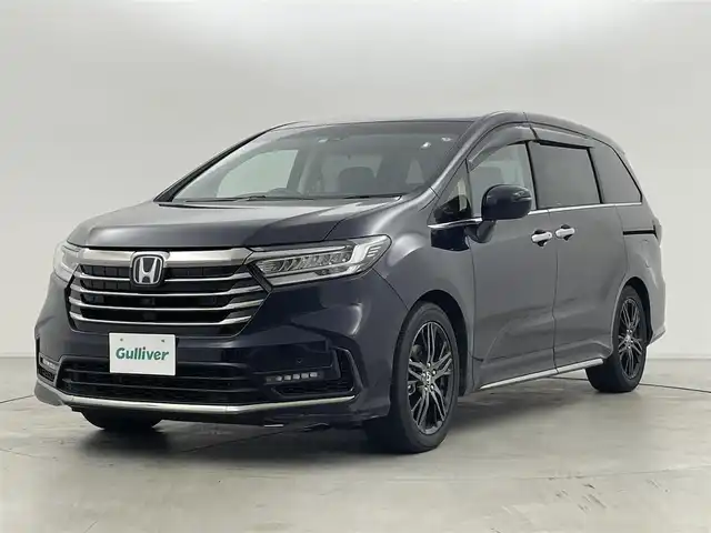 ホンダ オデッセイ ハイブリッド e:HEVアブソルート EX 群馬県 2021(令3)年 2.3万km プレミアムヴィーナスブラックP 本革シート/＝＝＝＝＝/純正10インチナビ/・AM/FM/CD/DVD/SD/フルセグTV/・Bluetooth/USB/HDMI/AppleCarPlay/純正フリップダウンモニター/マルチビューカメラシステム/Hondaスマートパーキングアシスト/ハンズフリーアクセスパワーテールゲート/ジェスチャーコントロール両側パワースライドドア/ホンダセンシング/・衝突軽減ブレーキ（CMBS）/・路外逸脱抑制機能/車線維持支援システム（LKAS）/・誤発進抑制機能/後方誤発進抑制機能/・歩行者事故低減ステアリング/・渋滞追従機能付アダプティブクルーズコントロール/・先行車発進お知らせ機能/標識認識機能/LEDアクティブコーナリングライト/ブラインドスポットインフォメーション/2列目プレミアムクレードルシート/前席パワーシート/シートヒーター/運転席大型アームレスト/AC100V電源/電動パーキングブレーキ/オートブレーキホールド