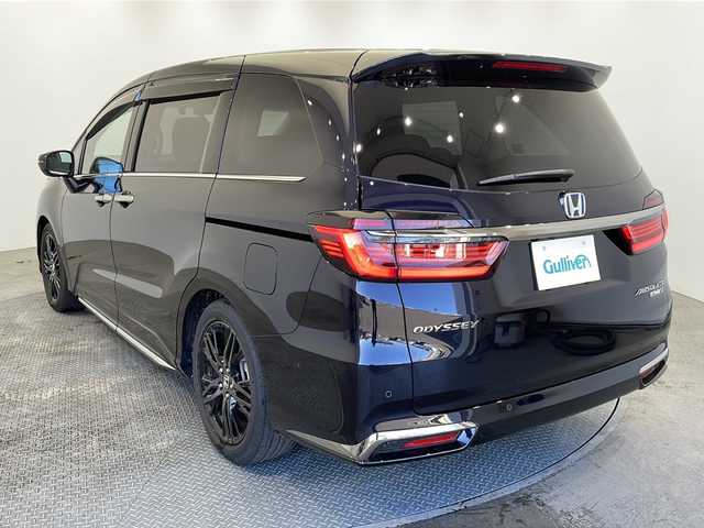 ホンダ オデッセイ ハイブリッド e:HEVアブソルート EX 群馬県 2021(令3)年 2.3万km プレミアムヴィーナスブラックP 純正10インチナビゲーション(VXU-217DYi)/(CD/DVD/Bluetooth/フルセグ)/バック/全方位カメラ/ホンダセンシング/・レーダークルーズコントロール/・レーンキープアシスト/・衝突被害軽減システム/横滑り防止装置/コーナーセンサー/100V充電/パワーバックドア/純正AW/前後ドライブレコーダー/前席パワーシート/前席シートヒーター/本革シート/両側パワースライドドア/オートライト/LEDヘッドライト