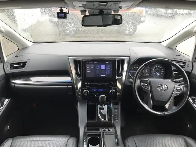 トヨタ ヴェルファイア ハイブリット ZR Gエディション 富山県 2020(令2)年 7万km ブラック ○ツインムーンルーフ/○純正9型ナビ(BT/CD/DVD)/○フルセグTV/○パワースライドドア(両側)/○バックモニター/○ビルトインETC/○ソーリンドライブレコーダー/○純正12.1型後席ディスプレイ/○レーダークルーズコントロール/○インテリジェントクリアランスソナー/○セーフティセンス/・プリクラッシュセーフティ/・レーントレーシングアシスト/・ロードサインアシスト/・アダプティブハイビームシステム/○3眼LEDヘッドランプ(AFS)/○デュアルオートエアコン/○木目調/革巻きコンビステアリング/○ステアリングヒーター/○前席パワーシート/快適温熱シート/○助手席パワーオットマン/○エグゼクティブパワーシート/○純正17インチアルミホイール/○スマートエントリー/プッシュスタートシステム/○禁煙車