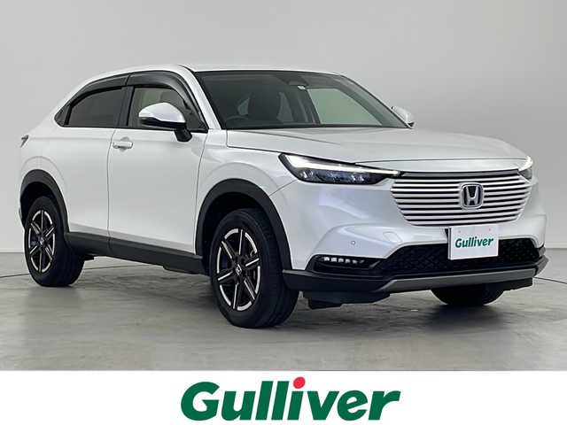 ホンダ ヴェゼル ハイブリッド e:HEV X 岐阜県 2023(令5)年 1.8万km プラチナホワイトパール 純正ナビ/　(AM/FM/Bluetooth/フルセグTV)/バックカメラ/衝突軽減ブレーキ/レーンキープアシスト/コーナーセンサー/レーダークルーズコントロール/ドライブレコーダー/ETC2.0/LEDヘッドライト/純正フロアマット/純正アルミホイール/スペアキー