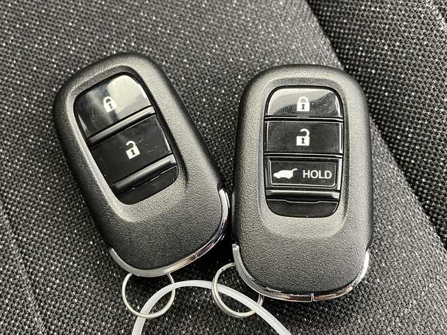 ホンダ ヴェゼル ハイブリッド e:HEV X 岐阜県 2023(令5)年 1.8万km プラチナホワイトパール 純正ナビ/　(AM/FM/Bluetooth/フルセグTV)/バックカメラ/衝突軽減ブレーキ/レーンキープアシスト/コーナーセンサー/レーダークルーズコントロール/ドライブレコーダー/ETC2.0/LEDヘッドライト/純正フロアマット/純正アルミホイール/スペアキー