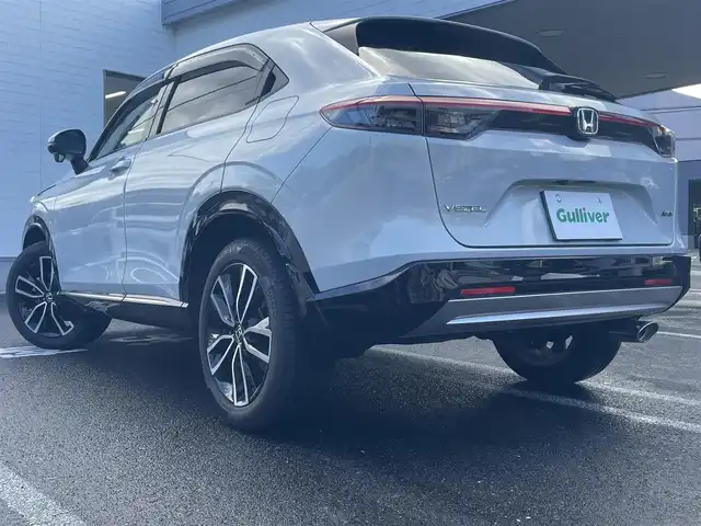 ホンダ ヴェゼル ハイブリッド e:HEV Z 長崎県 2021(令3)年 3.1万km プレミアムサンライトホワイトパール ワンオーナー車両/純正ディスプレイオーディオ（ナビ機能、フルセグ、AM、FM、BTオーディオ、AppleCarPlay、AndroidAuto）/バックカメラ/電動リアゲート/クルーズコントロール/パドルシフト/DNシートヒーター/ハーフレザー調シートカバー/ETC/BSM/電動パーキング/パーキングセンサー/電動格納ウインカーミラー