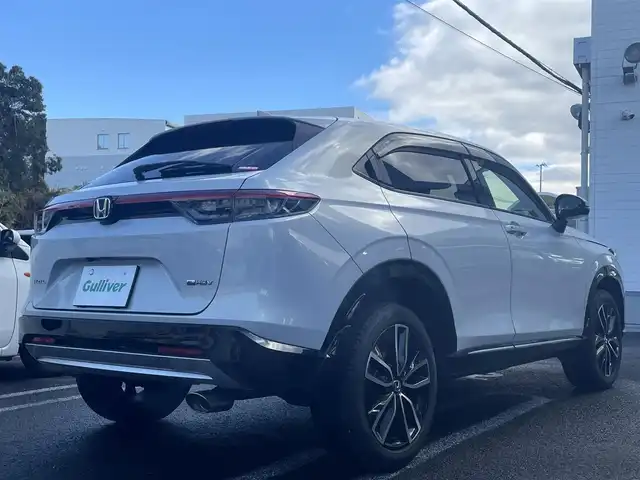 ホンダ ヴェゼル ハイブリッド e:HEV Z 長崎県 2021(令3)年 3.1万km プレミアムサンライトホワイトパール ワンオーナー車両/純正ディスプレイオーディオ（ナビ機能、フルセグ、AM、FM、BTオーディオ、AppleCarPlay、AndroidAuto）/バックカメラ/電動リアゲート/クルーズコントロール/パドルシフト/DNシートヒーター/ハーフレザー調シートカバー/ETC/BSM/電動パーキング/パーキングセンサー/電動格納ウインカーミラー