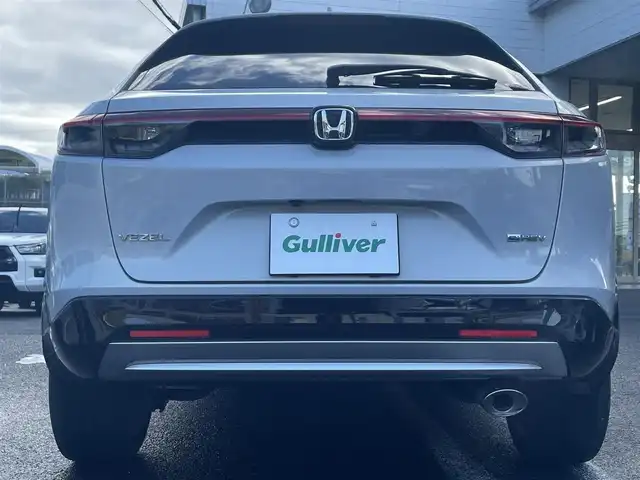 ホンダ ヴェゼル ハイブリッド e:HEV Z 長崎県 2021(令3)年 3.1万km プレミアムサンライトホワイトパール ワンオーナー車両/純正ディスプレイオーディオ（ナビ機能、フルセグ、AM、FM、BTオーディオ、AppleCarPlay、AndroidAuto）/バックカメラ/電動リアゲート/クルーズコントロール/パドルシフト/DNシートヒーター/ハーフレザー調シートカバー/ETC/BSM/電動パーキング/パーキングセンサー/電動格納ウインカーミラー
