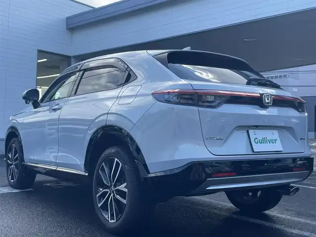 ホンダ ヴェゼル ハイブリッド e:HEV Z 長崎県 2021(令3)年 3.1万km プレミアムサンライトホワイトパール ワンオーナー車両/純正ディスプレイオーディオ（ナビ機能、フルセグ、AM、FM、BTオーディオ、AppleCarPlay、AndroidAuto）/バックカメラ/電動リアゲート/クルーズコントロール/パドルシフト/DNシートヒーター/ハーフレザー調シートカバー/ETC/BSM/電動パーキング/パーキングセンサー/電動格納ウインカーミラー