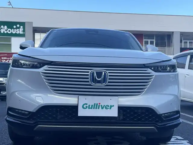 ホンダ ヴェゼル ハイブリッド e:HEV Z 長崎県 2021(令3)年 3.1万km プレミアムサンライトホワイトパール ワンオーナー車両/純正ディスプレイオーディオ（ナビ機能、フルセグ、AM、FM、BTオーディオ、AppleCarPlay、AndroidAuto）/バックカメラ/電動リアゲート/クルーズコントロール/パドルシフト/DNシートヒーター/ハーフレザー調シートカバー/ETC/BSM/電動パーキング/パーキングセンサー/電動格納ウインカーミラー