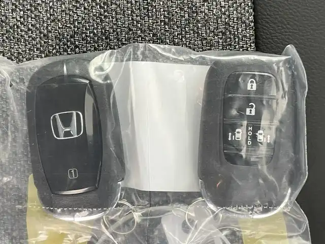 ホンダ フリード ハイブリット e:HEV AIR EX 千葉県 2025(令7)年 0.1千km クリスタルブラックパール 登録済未使用車/純正9インチナビ/・LXM-242VFNi/・BT/ACP/AA/フルセグ/Honda SENSING/・衝突軽減ブレーキ（CMBS）/・先行車発進お知らせ機能/・歩行者事故低減ステアリング/・路外逸脱抑制機能/・標識認識機能/・渋滞追従機能付アダプティブクルーズコントロール（ACC）/・車線維持支援システム（LKAS）/・トラフィックジャムアシスト（渋滞運転支援機能）/・誤発進抑制機能/・後方誤発進抑制機能/・近距離衝突軽減ブレーキ/・急アクセル抑制機能/・パーキングセンサーシステム/・オートハイビーム/両側パワースライドドア/バックカメラ/ブラインドスポットインフォメーション/リアクーラー/前席シートヒーター/LEDヘッドライト/スマートキー/スペアキー/純正15インチアルミホイール/取扱説明書/保証書