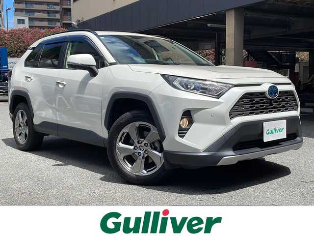 トヨタ ＲＡＶ４ ハイブリットG 神奈川県 2021(令3)年 8.9万km ホワイトパールクリスタルシャイン ワンオーナー/4WD/純正ディスプレイオーディオ/・DTV/Bluetooth/USB/全方位カメラ/クリアランスソナー/レザーシート/D席パワーシート/前席シートヒーター/パワーバックドア/ルーフレール/置くだけ充電/ビルトインETC2.0/前後ドライブレコーダー/ブラインドスポットモニター/ToyotaSafetySense/・プリクラッシュセーフティ/・レーントレーシングアシスト/・オートマチックハイビーム/・ロードサインアシスト/・レーダークルーズコントロール/・先行車発進告知機能/リヤクロストラフィックアラート/パーキングサポートブレーキ/トレイルモード/純正18インチAW/100V電源/プッシュEgスタート/ストップ/スマートキー×2/純正LEDヘッドライト/ダブル/サイド/カーテンエアバッグ/ドアバイザー/純正フロアマット/取扱説明書/マルチメディア取扱説明書/新車時保証書