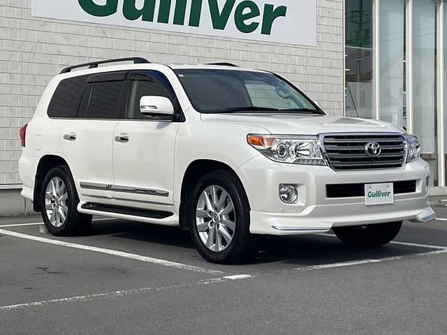 トヨタ ランドクルーザー ZX 静岡県 2014(平26)年 5.7万km ホワイトパールクリスタルシャイン 純正ナビ/地デジTV/純正CD/Bluetooth/バックカメラ/モデリスタエアロ/ガナドールマフラー/フリップダウンリアモニター/サンルーフ/シートヒーター＆ベンチレーション/2列目シートヒーター/ステアリングヒーター/純正20インチＡＷ/クルーズコントロール/エアサス