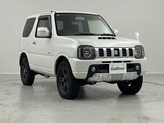 スズキ ジムニー クロスアドベンチャー 茨城県 2012(平24)年 4.9万km パールホワイト ターボ車　ＳＤナビ　シートヒーター　ヘッドライトレベライザー　ＥＴＣ　純正フロアマット　純正シート　背面タイヤ　ハロゲンヘッドライト　背面タイヤカバー　純正アルミホイール　電動格納ミラー　禁煙車