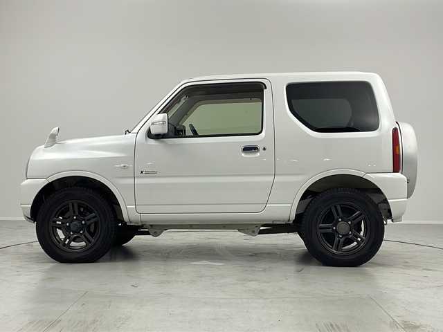 スズキ ジムニー クロスアドベンチャー 茨城県 2012(平24)年 4.9万km パールホワイト ターボ車　ＳＤナビ　シートヒーター　ヘッドライトレベライザー　ＥＴＣ　純正フロアマット　純正シート　背面タイヤ　ハロゲンヘッドライト　背面タイヤカバー　純正アルミホイール　電動格納ミラー　禁煙車