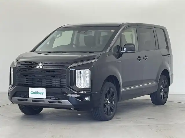 三菱 デリカＤ：５ シャモニー 群馬県 2025(令7)年 0.1千km 黒Ⅱ 登録済未使用車(登録時走行距離：13km)/オリジナルナビ取付パッケージ＋リアモニター取付パッケージ/＝＝＝＝＝/e-Assist(運転支援機能)/・衝突被害軽減ブレーキ(FCM)/・車線逸脱警報システム(LDW)/・レーダークルーズコントロール(ACC)/・オートマチックハイビーム(AHB)/・後側方車両検知警報システム(レーンチェンジアシスト機能付)/・誤発進抑制機能(前進時)/・後退時交差車両検知警報(RCTA)/両側パワースライドドア/エレクトリックテールゲート/ハーフレザーシート/前席シートヒーター/ステアリングヒーター/革巻きステアリング/ステアリングスイッチ/アイドリングストップ/電動パーキングブレーキ/オートブレーキホールド/プッシュスタート/スマートキー×2本/取扱説明書/保証書