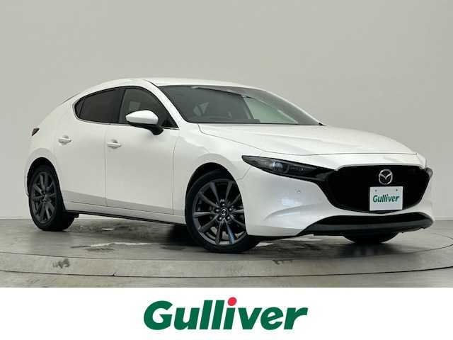 マツダ マツダ３ファストバック XD Lパッケージ 宮城県 2020(令2)年 5.7万km スノーフレイクホワイトパールマイカ 4WD/純正SDナビ/・BT/USB/AM/FM/HDMI/ヘッドアップディスプレイ/クルージング＆トラフィックサポート/純正18インチアルミホイール/オートマチックハイビーム/オートライト/バックカメラ/レザーシート/シートヒーター/ステアリングヒーター/LEDヘッドライト/クリアランスソナー/ABS/衝突被害軽減システム/禁煙車
