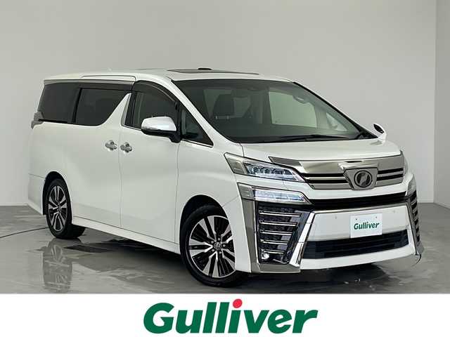 トヨタ ヴェルファイア Z Gエディション 愛知県 2019(令1)年 4.7万km ホワイトパールクリスタルシャイン 禁煙車/ALPINEヴェルファイア専用ナビ(EX11Z)/ALPINEヴェルファイア専用プラズマクラスター搭載リアビジョン(PXH12X-R-AV)/バックカメラ/ビルトインETC/ツインムーンルーフ/パワーバックドア/Z専用エアロ外装/3眼LEDヘッドランプ/オートライト/フロントフォグランプ/トヨタセーフティセンス/プリクラッシュセーフティ/レーントレーシングアシスト/レーダークルーズコントロール/ロードサインアシスト/アダプティブハイビームシステム/先行車発進告知/インテリジェントクリアランスソナー/パーキングサポートブレーキ(静止物)/両側ワンタッチパワースライドドア/黒合皮シート/前席パワーシート/前席快適温熱シート&ベンチレーション/運転席ポジションメモリー/助手席パワーオットマン/2列目エグゼクティブパワーシート/3列目スペースアップシート/メタルウッド&スパッタリング内装/本革&メタルウッドステアリング/ステアスイッチ/ステアヒーター/電子パーキングブレーキ/ブレーキホールド/プッシュスタート/電動格納ミラーウィンカー/新車保証書・取扱説明書