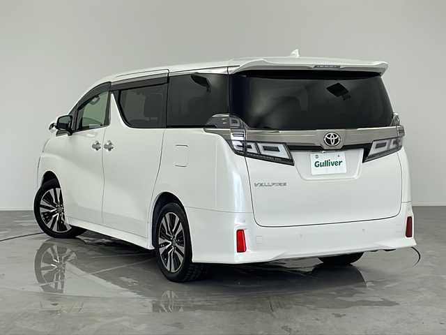 トヨタ ヴェルファイア Z Gエディション 愛知県 2019(令1)年 4.7万km ホワイトパールクリスタルシャイン 禁煙車/ALPINEヴェルファイア専用ナビ(EX11Z)/ALPINEヴェルファイア専用プラズマクラスター搭載リアビジョン(PXH12X-R-AV)/バックカメラ/ビルトインETC/ツインムーンルーフ/パワーバックドア/Z専用エアロ外装/3眼LEDヘッドランプ/オートライト/フロントフォグランプ/トヨタセーフティセンス/プリクラッシュセーフティ/レーントレーシングアシスト/レーダークルーズコントロール/ロードサインアシスト/アダプティブハイビームシステム/先行車発進告知/インテリジェントクリアランスソナー/パーキングサポートブレーキ(静止物)/両側ワンタッチパワースライドドア/黒合皮シート/前席パワーシート/前席快適温熱シート&ベンチレーション/運転席ポジションメモリー/助手席パワーオットマン/2列目エグゼクティブパワーシート/3列目スペースアップシート/メタルウッド&スパッタリング内装/本革&メタルウッドステアリング/ステアスイッチ/ステアヒーター/電子パーキングブレーキ/ブレーキホールド/プッシュスタート/電動格納ミラーウィンカー/新車保証書・取扱説明書