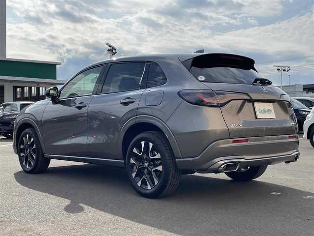 ホンダ ＺＲ－Ｖ ハイブリッド e:HEV Z 東京都 2025(令7)年 0.2万km グレー 純正９型ナビ/・AM/FM/フルセグ/BOSEサウンドシステム/アラウンドビューモニター/前席シートヒーター/運転席メモリパワーシート/・前席パワーシート/ブラインドスポットモニター/前後ドライブレコーダー/おくだけ充電/ステアリングヒーター/LEDヘッドランプ/ホンダセンシング/（予防運転支援システム）/・衝突軽減ブレーキ/・後方誤発進抑制機能/・歩行者事故低減ステアリング/・追従機能付きクルーズコントロール/・車線維持支援システム/・標識認識機能/・後退時出庫サポート/・パーキングセンサーシステム/プッシュエンジンスタート/純正フロアマット/スマートキー