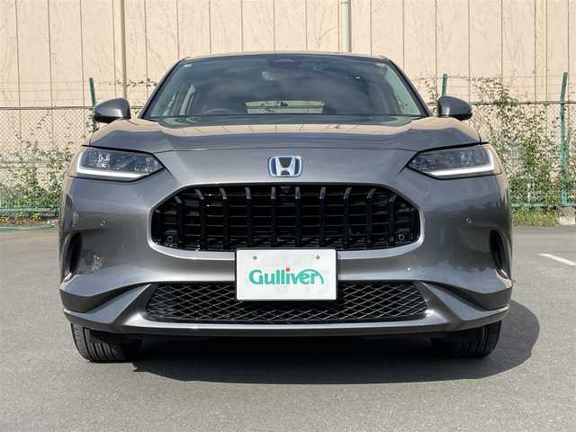 ホンダ ＺＲ－Ｖ ハイブリッド e:HEV Z 東京都 2025(令7)年 0.2万km グレー 純正９型ナビ/・AM/FM/フルセグ/BOSEサウンドシステム/アラウンドビューモニター/前席シートヒーター/運転席メモリパワーシート/・前席パワーシート/ブラインドスポットモニター/前後ドライブレコーダー/おくだけ充電/ステアリングヒーター/LEDヘッドランプ/ホンダセンシング/（予防運転支援システム）/・衝突軽減ブレーキ/・後方誤発進抑制機能/・歩行者事故低減ステアリング/・追従機能付きクルーズコントロール/・車線維持支援システム/・標識認識機能/・後退時出庫サポート/・パーキングセンサーシステム/プッシュエンジンスタート/純正フロアマット/スマートキー