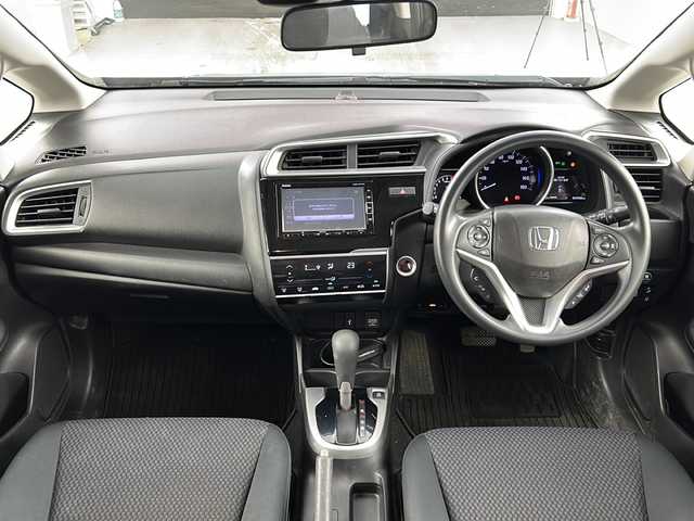 ホンダ フィット 13G L ホンダセンシング 愛知県 2017(平29)年 4.4万km ミッドナイトブルービームM 純正7型ナビ【Bluetooth CD DVD SD 品番：VXM-184VF】/バックカメラ/ドライブレコーダー/ホンダセンシング/・衝突軽減ブレーキ/・路外逸脱抑制機能/・先行車発進お知らせ/・アダプティブクルーズコントロール/・車線維持支援システム/・標識認識機能/横滑り防止装置/ECON/ステアリングリモコン/ドアバイザー/純正フロアマット/禁煙車