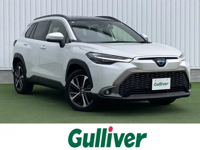 トヨタ カローラ クロス ハイブリッド Z 香川県 2023(令5)年 1.2万km プラチナホワイトパールマイカ ワンオーナー/トヨタセーフティー/・プリクラッシュ/・LTA/純正9インチDA/パノラマルーフ/バックカメラ/ハーフレザーシート/パワーシート/シートヒーター/パワーバックドア/革巻きステアリング/ステアリングリモコン/レーダークルーズ/BSM/LEDライト/スマートキー