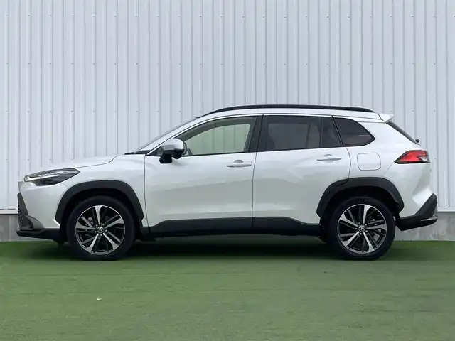 トヨタ カローラ クロス ハイブリッド Z 香川県 2023(令5)年 1.2万km プラチナホワイトパールマイカ ワンオーナー/トヨタセーフティー/・プリクラッシュ/・LTA/純正9インチDA/パノラマルーフ/バックカメラ/ハーフレザーシート/パワーシート/シートヒーター/パワーバックドア/革巻きステアリング/ステアリングリモコン/レーダークルーズ/BSM/LEDライト/スマートキー