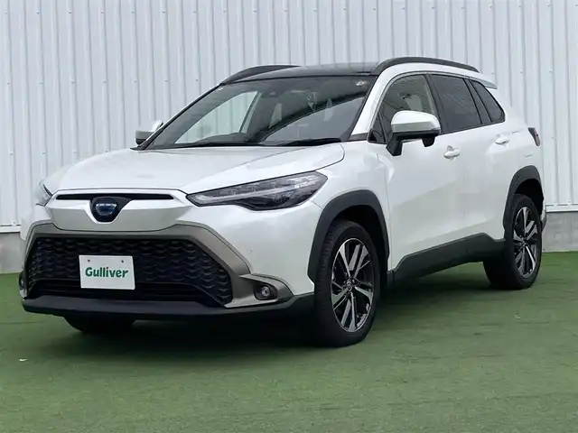 トヨタ カローラ クロス ハイブリッド Z 香川県 2023(令5)年 1.2万km プラチナホワイトパールマイカ ワンオーナー/トヨタセーフティー/・プリクラッシュ/・LTA/純正9インチDA/パノラマルーフ/バックカメラ/ハーフレザーシート/パワーシート/シートヒーター/パワーバックドア/革巻きステアリング/ステアリングリモコン/レーダークルーズ/BSM/LEDライト/スマートキー