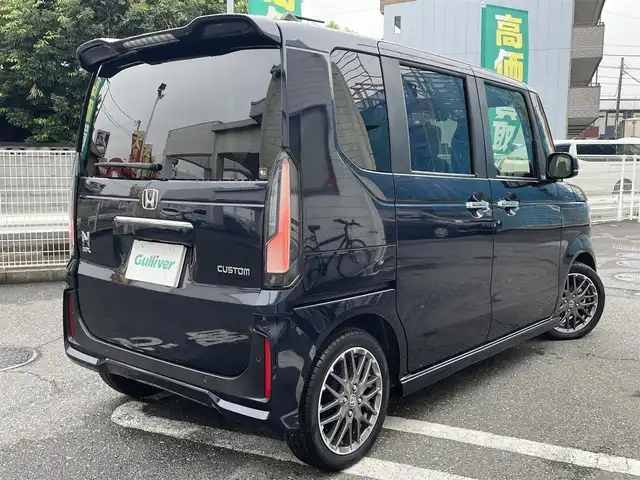 ホンダ Ｎ ＢＯＸ カスタム ターボ 埼玉県 2024(令6)年 0.4万km ミッドナイトブルービームM Honda SENSING/・衝突軽減ブレーキ/・踏み間違い衝突軽減システム/・パーキングセンサー警報/・車線維持支援システム/・アダプティブクルーズコントロール/Honda CONNECT for Gathers純正ナビ/DTV/BT/CD/DVD/SD/USB/iPod/Apple CarPlay/Android Auto/Music Rack/ハーフレザーシート/前席シートヒーター/両側パワースライドドア/マルチビューカメラ/パドルシフト/チップアップシート/ コンビニフック付シートバックテーブル(運転席＆助手席)/ オートリトラミラー/ 左右独立式リアセンターアームレスト/ 本革巻ステアリング/社外ドライブレコーダー/【VREC-DZ210D】/ビルトインETC/プッシュスタート/スマートキー/スペアキー