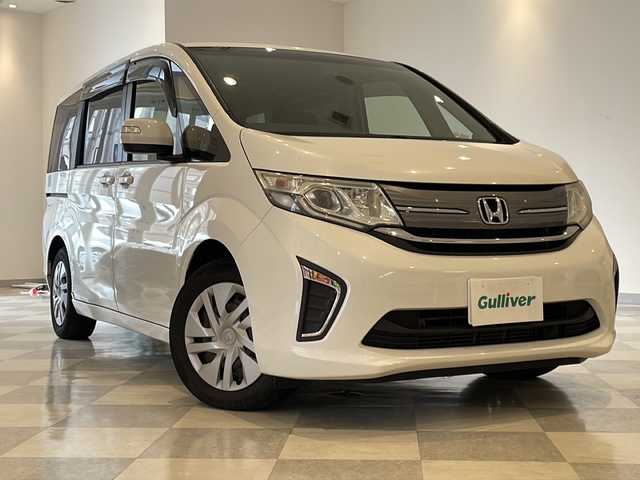 ホンダ ステップワゴン G 福井県 2016(平28)年 8万km ホワイトオーキッドパール 純正9インチナビ/フルセグTV/バックカメラ/フリップダウンモニター/クルーズコントロール/ETC/前後ドライブレコーダー/両側パワースライドドア/オートライト/HIDヘッドライト/社外AW付スタッドレスタイヤ車載/プッシュスタート/スマートキー×2/ステアリングスイッチ/純正フロアマット
