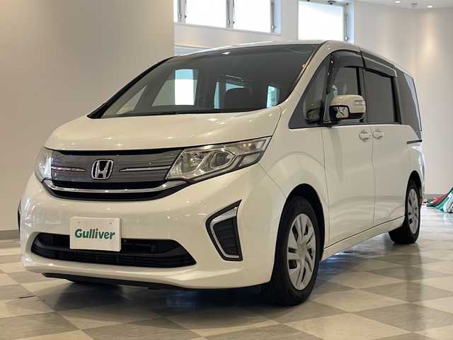 ホンダ ステップワゴン G 福井県 2016(平28)年 8万km ホワイトオーキッドパール 純正9インチナビ/フルセグTV/バックカメラ/フリップダウンモニター/クルーズコントロール/ETC/前後ドライブレコーダー/両側パワースライドドア/オートライト/HIDヘッドライト/社外AW付スタッドレスタイヤ車載/プッシュスタート/スマートキー×2/ステアリングスイッチ/純正フロアマット
