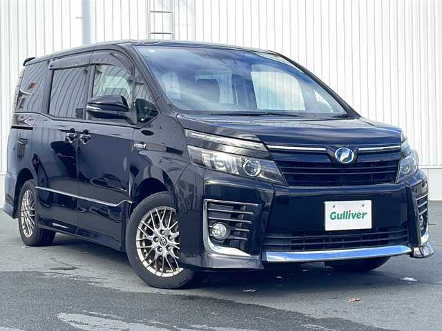 トヨタ ヴォクシー ハイブリッド ZS 三重県 2016(平28)年 13.5万km ブラック ALPINE10型ナビ/ALPINE12.8型フリップダウンモニター/バックカメラ/フルセグTV/前後ドラレコ/ETC/HDMI/USB入力/ステアリングスイッチ/レーンキープアシスト/衝突被害軽減システム/LEDヘッドライト/オートハイビーム/リアサンシェード/オートリトラミラー