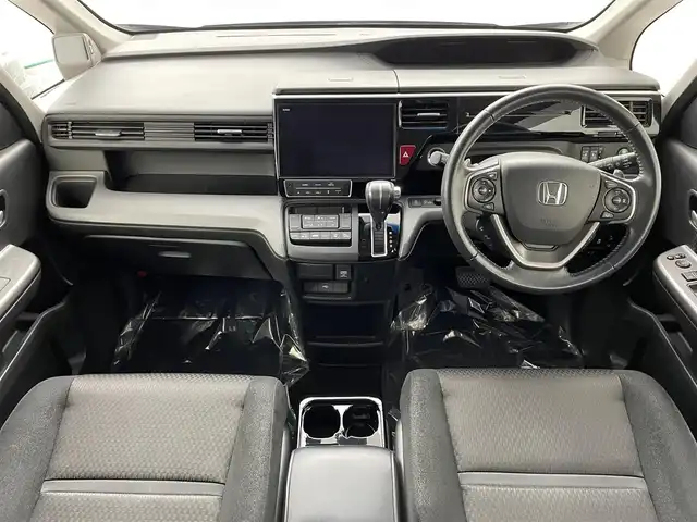 ホンダ ステップワゴン スパーダ ホンダセンシング 埼玉県 2019(令1)年 5.5万km プレミアムスパークルブラックパール ホンダセンシング　純正１０インチナビ　フルセグＴＶ　Ｂｌｕｅｔｏｏｔｈ　バックカメラ　純正１１．６インチフリップダウンモニター　両側パワースライドドア　レーダークルーズコントロール　ＥＴＣ　ドラレコ