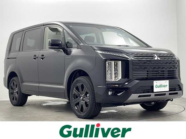 三菱 デリカＤ：５ シャモニー 大阪府 2025(令7)年 0.1千km 黒 登録済み未使用車/バックカメラ(全方位)/100V電源/クルーズコントロール(追従走行あり)/ブラインドスポットモニター/パドルシフト/オートライト/オートマチックハイビーム/衝突軽減システム/横滑り防止システム/ステアリングヒーター/パワーシート(運転席)/パワーバックドア/両側パワースライドドア/スマートキー/純正18インチAW/保証書/取扱説明書